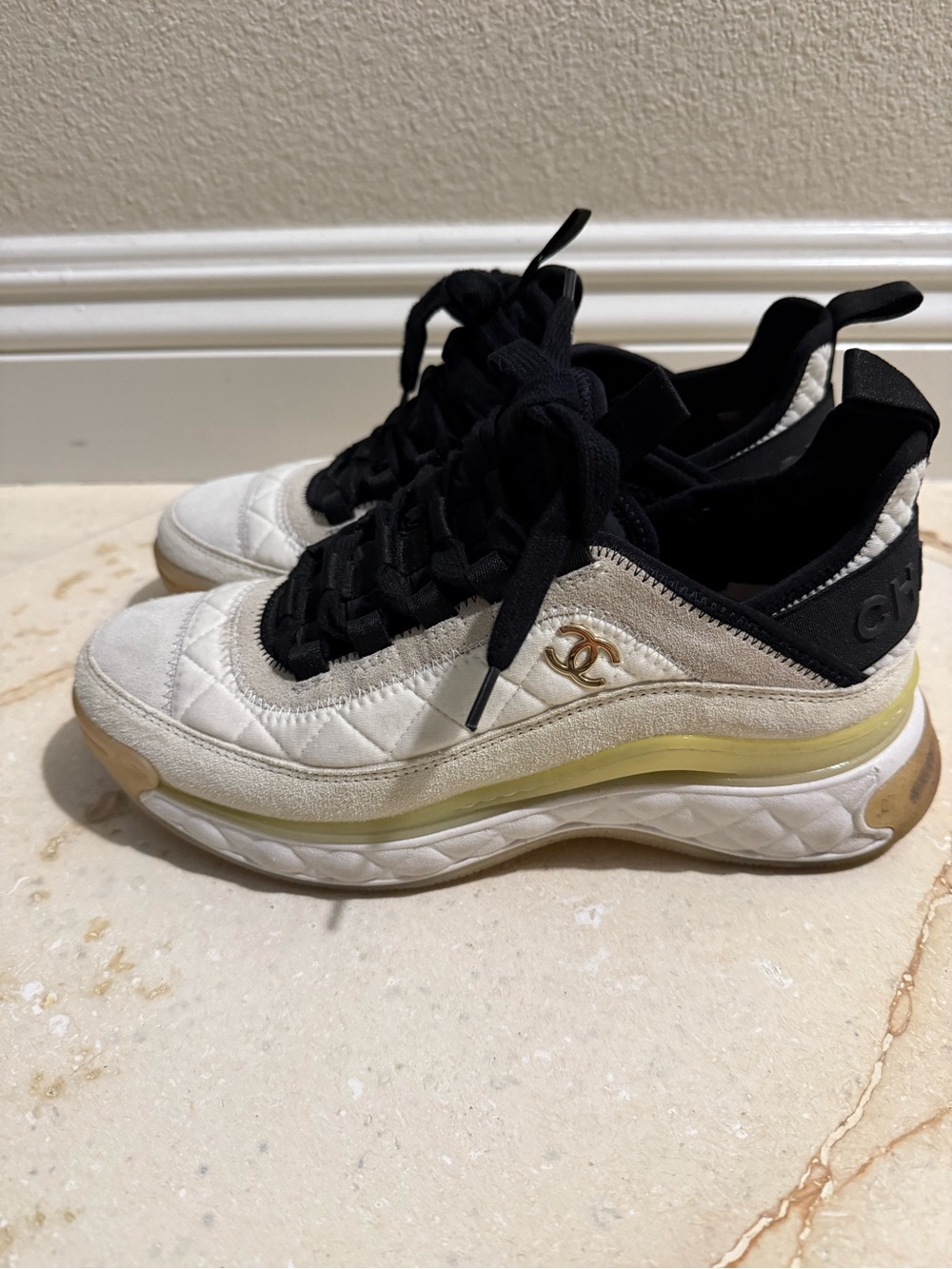 CHANEL Cream and Black Quilted Low-Top Sneakers with Gold CC